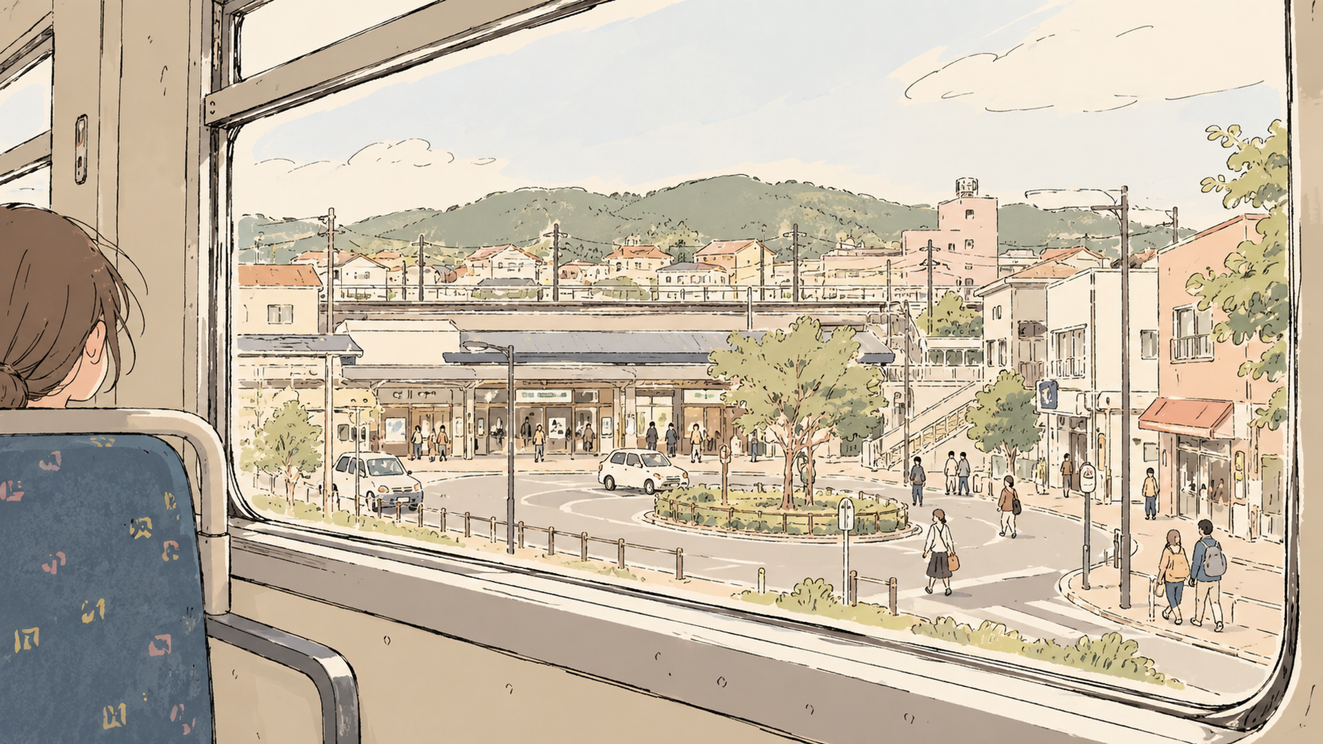 在来線の車窓から見える郊外の駅前の街並み